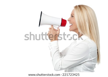 Woman speaking over a megaphone making a public announcement