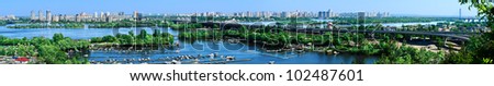 panorama of city landscape and nature. Kiev, Ukraine. Green trees, architecture, and blue river