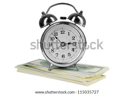 old style alarm clock and a lot of dollars.  isolated on white
