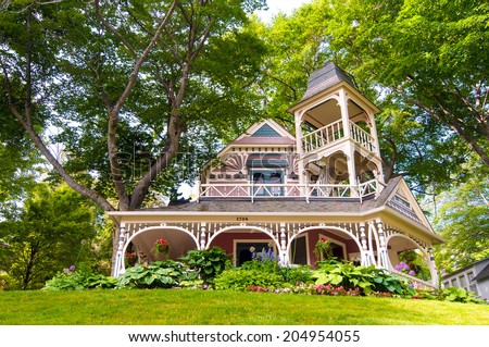 BAY VIEW, MI - JUNE 26, 2014: This ornately decorated house is one of many quaint old residences in the resort village of Bay View, once a Methodist camp retreat, next to Petoskey on Lake Michigan.