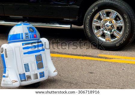 TWINSBURG, OH, USA - AUGUST 8, 2015: A remote-controlled inflatable R2-D2 takes part in the Double Take Parade, in the 40th annual Twins Day festival in the southeastern suburb of Cleveland.