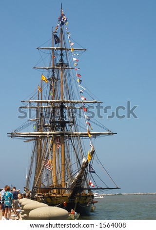 A tall ship (brig) at dockside
