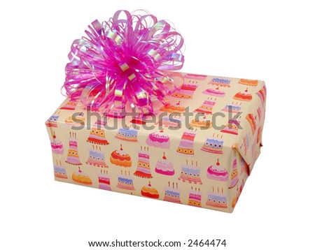 Birthday present wrapped in yellow paper showing cakes