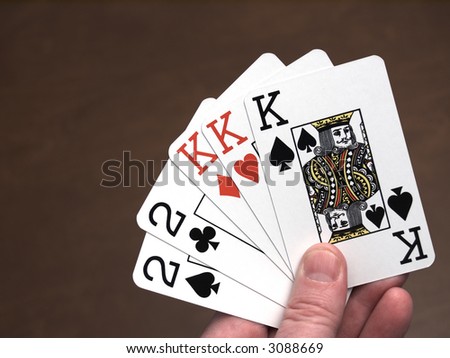 Poker hand, full house, consisting of three kings and a pair of twos