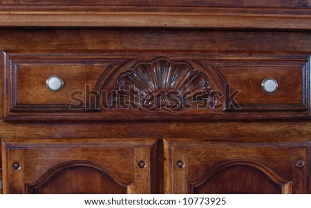 Detail of center drawer of old cabinet, with scallop design