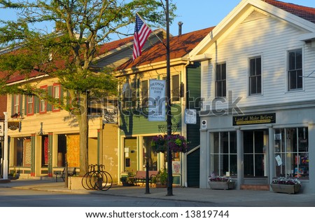 Early morning sunlight on businesses of a quaint village main street