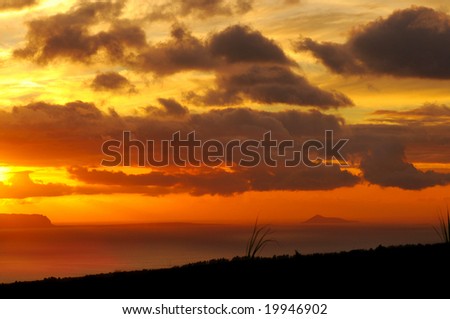 Sunset over the island of Niihau, taken from high ground on Kauai, Hawaii