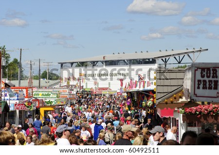 BURTON, OH - SEPT 5: Crowds throng the midway at the 188th annual Great Geauga County Fair, the state\'s oldest continuously running fair on September 5, 2010 in Burton, Ohio.