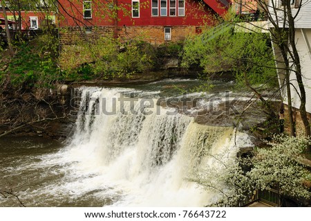 The springtime torrent of Chagrin Falls in Chagrin Falls, Ohio - stock photo