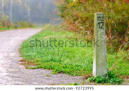 Stone mile marker on a hiking/jogging trail