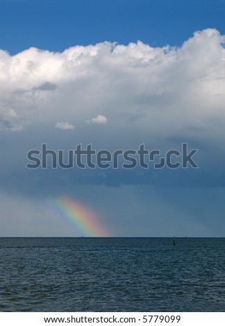 rainbow on the sea after a  storm