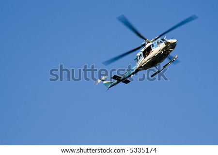 Helicopter on a dark blue sky. Horizontal shot.