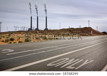 Black asphalt road going to a power plant, or to somewhere else. Environmental concept.