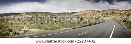 Black asphalt road through the desert in arizona, United States.
