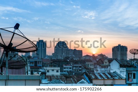 Antenna communication satellite dish with sky background, Satellite dish on the roof at sunset