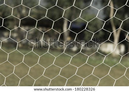 A close up of a soccer net , Soccer goal net