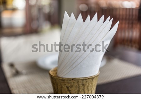 tissue paper in glass on the table