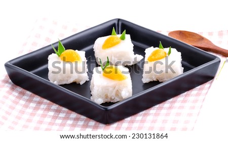 Thai dessert made from glutinous rice and sprinkle with coconut milk and golden Thai dessert