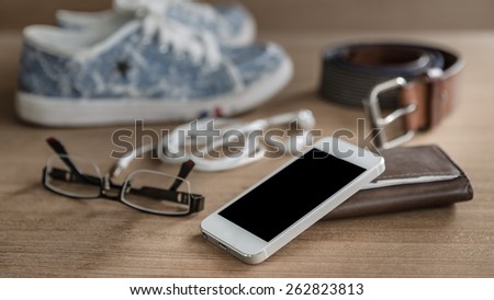 Still life concept of traveling all over the world with mobile phone