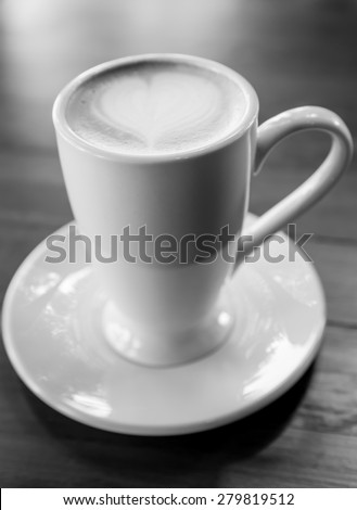Latte Art coffee, cup of latte art coffee on wood table black & white