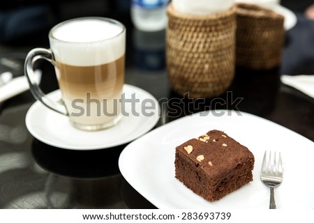 Cake chocolate brownies and coffee latte, chocolate brownie