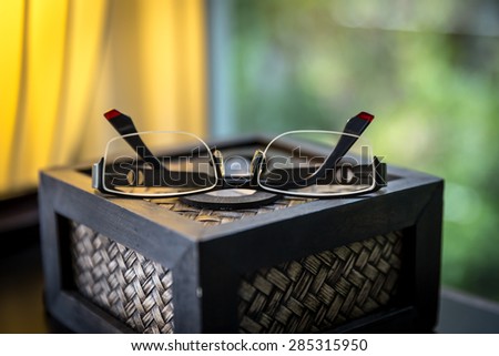 modern glasses closeup on tissue box