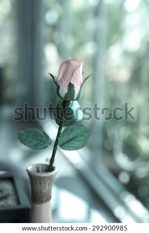 single artificial roses in a vase, artificial rose - Vintage Style