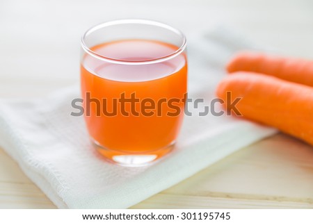 glasses of carrot juice and fresh carrot, carrot juice and fresh carrot