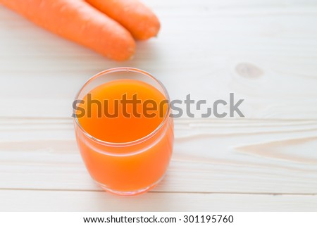 glasses of carrot juice and fresh carrot, carrot juice and fresh carrot