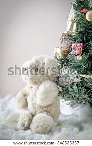 christmas teddy bear sitting in the snow,christmas teddy bear