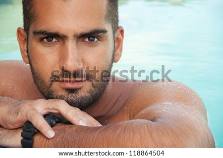 Wet, Handsome man portrait in water. Horizontal close up. Outdoor shot.