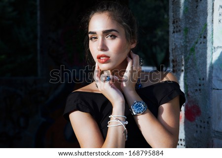 Sensual woman with necklace and bright make up. Jewelry concept. Urban - street style . Outdoors shot.