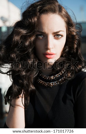 mystical woman with necklace and bright make up. Jewelry concept. Urban - street style . Outdoors shot.