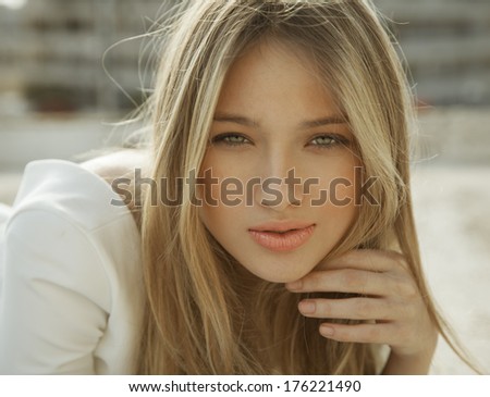 Wonderful  woman with a lovely look and bright make up. horizontal shot. outdoors