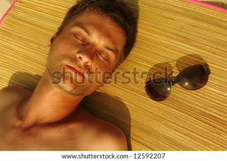 Man Sunbathing on the beach