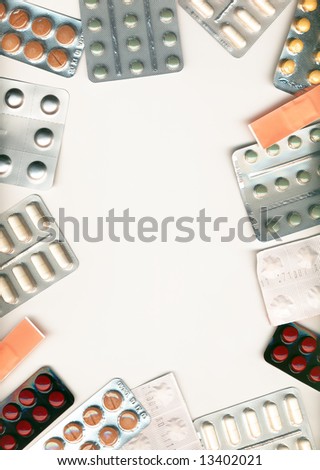 A frame made of different pills, isolated on white
