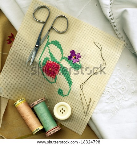 Sewing needle with bobbins of cotton thread and needlework