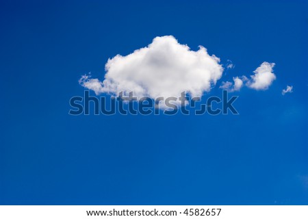 Single simple cloud over deep blue vivid sky