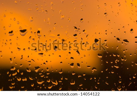 Abstract orange water drops background with dark areas