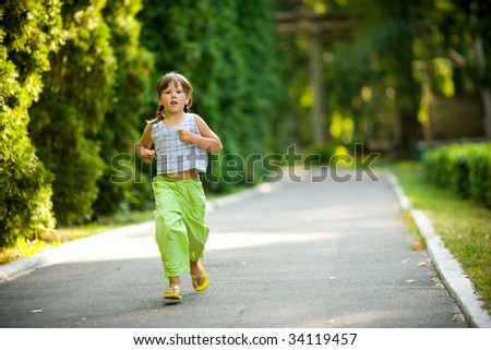 Five years Child jogging in morning summer park