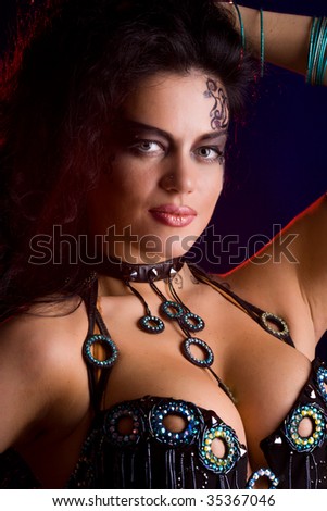 stock photo Beautiful woman wearing tribal makeup and dress