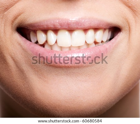 Happy cheerful girl\'s smile with white teeth isolated on white