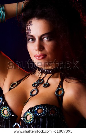 stock photo Beautiful woman wearing tribal makeup and dress