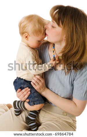 Mother kissing sick son\'s forehead isolated on white