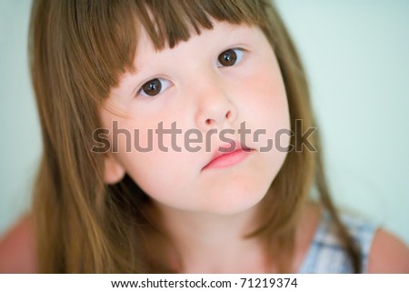 Five years girl with brown eyes closeup portrait