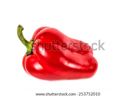 studio picture of a single red bell pepper on a white background