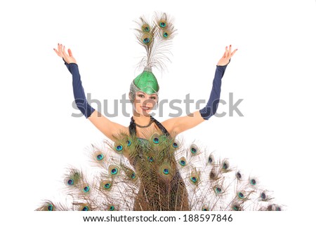Burlesque dancer with peacock feathers and green dress