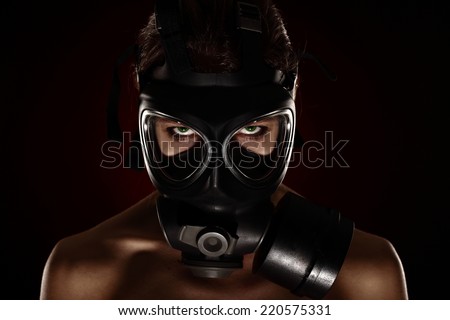 Sexy Woman wearing a Ammo Gas Mask, studio
