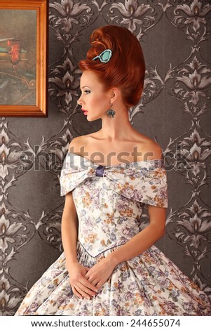 Luxury young beautiful woman in vintage victorian dress studio