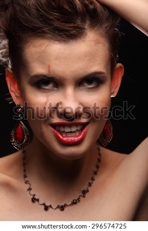 beautiful girl with a scar on face and shoulder studio